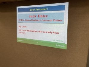 Sign for presenter Judy Ehley