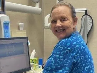 Staff member smiling